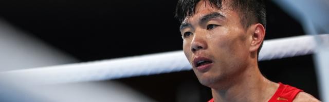 世界杯官方直播平台下载-视网膜两次脱落 胡建关靠毅力站在东奥拳击赛场